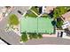 Aerial view of a tennis court within a gated community. Plenty of parking is available and surrounding greenery at 15151 N Frank Lloyd Wright Blvd # 1088, Scottsdale, AZ 85260