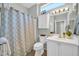 Bathroom featuring a combination shower and tub, vanity, and a decorative curtain at 15161 W Cactus Ridge Way, Surprise, AZ 85374