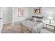 Cozy bedroom with neutral carpet, side table, and serene wall art at 15161 W Cactus Ridge Way, Surprise, AZ 85374