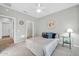 Neutral bedroom featuring a ceiling fan, carpet, and a stylish glass side table at 15161 W Cactus Ridge Way, Surprise, AZ 85374
