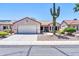 Charming single-story home with desert landscaping and a two-car garage, under a clear blue sky at 15161 W Cactus Ridge Way, Surprise, AZ 85374
