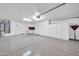 A large garage featuring white walls, cabinets, and sealed concrete floors at 15161 W Cactus Ridge Way, Surprise, AZ 85374