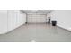 Spacious garage with white walls and sealed concrete flooring at 15161 W Cactus Ridge Way, Surprise, AZ 85374