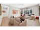 Cozy living room filled with natural light, a ceiling fan, and neutral walls at 15161 W Cactus Ridge Way, Surprise, AZ 85374