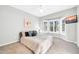 Bright bedroom with a bay window, ceiling fan, and carpet flooring at 15161 W Cactus Ridge Way, Surprise, AZ 85374