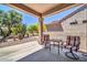 Charming covered patio featuring desert landscaping offering a serene outdoor space at 15161 W Cactus Ridge Way, Surprise, AZ 85374