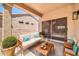 Inviting covered patio with comfortable seating, perfect for outdoor relaxation and entertaining at 15161 W Cactus Ridge Way, Surprise, AZ 85374
