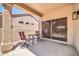 Cozy covered patio with seating, ideal for enjoying outdoor living and relaxing at 15161 W Cactus Ridge Way, Surprise, AZ 85374
