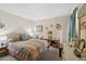 Spacious bedroom featuring a bed with colorful patchwork-style quilt and neutral gray carpet at 16276 E Rosetta Dr # 58, Fountain Hills, AZ 85268