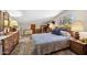 Bedroom with natural light, spacious dresser, and comfortable bed with blue decorative pillows at 16276 E Rosetta Dr # 58, Fountain Hills, AZ 85268