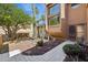 Landscaped front yard featuring desert plants and a decorative walkway to the front door at 16276 E Rosetta Dr # 58, Fountain Hills, AZ 85268