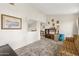 Bright living space with vintage furniture and view of adjacent room through window at 16276 E Rosetta Dr # 58, Fountain Hills, AZ 85268