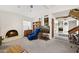 Relaxing living room with cozy chair and adjacent staircase at 16276 E Rosetta Dr # 58, Fountain Hills, AZ 85268
