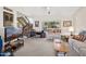 Bright living room with staircase access and view to the outside at 16276 E Rosetta Dr # 58, Fountain Hills, AZ 85268