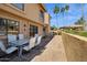 View of the back patio with dining furniture and lush landscaping at 16276 E Rosetta Dr # 58, Fountain Hills, AZ 85268