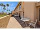View of the back patio with dining furniture and lush landscaping at 16276 E Rosetta Dr # 58, Fountain Hills, AZ 85268