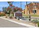 Community signage featuring desert landscaping and a decorative fountain at 16276 E Rosetta Dr # 58, Fountain Hills, AZ 85268