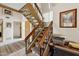 Carpeted staircase with wood and metal railing, leading to the upper level of the home at 16276 E Rosetta Dr # 58, Fountain Hills, AZ 85268