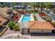 Aerial view of complex featuring community pool, spa, and lush landscaping at 16734 E Gunsight Dr # 109, Fountain Hills, AZ 85268