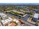 Scenic view of residential buildings, manicured landscape, parking areas, and a lake in the background at 16734 E Gunsight Dr # 109, Fountain Hills, AZ 85268