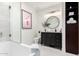 Bright bathroom features marble tile, sleek vanity, and a framed flamingo print at 16734 E Gunsight Dr # 109, Fountain Hills, AZ 85268