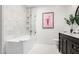 Bright bathroom features marble tile, sleek vanity, and a framed flamingo print at 16734 E Gunsight Dr # 109, Fountain Hills, AZ 85268