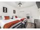 Bedroom with twin beds, wood floors, and en suite bathroom at 16734 E Gunsight Dr # 109, Fountain Hills, AZ 85268