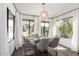 Sun-drenched dining room featuring modern furnishings and picturesque outdoor views, perfect for Gathering meals at 16734 E Gunsight Dr # 109, Fountain Hills, AZ 85268