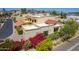 Charming home featuring a private garage, gravel driveway, and vibrant flowering shrubbery at 16734 E Gunsight Dr # 109, Fountain Hills, AZ 85268