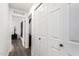 Hallway with neutral paint, closet and view into den with console at 16734 E Gunsight Dr # 109, Fountain Hills, AZ 85268