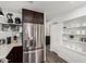 Modern kitchen showcasing stainless steel refrigerator and well-organized shelving, ideal for streamlined living at 16734 E Gunsight Dr # 109, Fountain Hills, AZ 85268