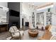 Spacious living area featuring a cozy fireplace, modern decor, and an open layout perfect for entertaining guests at 16734 E Gunsight Dr # 109, Fountain Hills, AZ 85268
