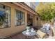 Inviting outdoor patio with comfortable seating, landscaping and sunshine at 16734 E Gunsight Dr # 109, Fountain Hills, AZ 85268