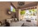 Inviting outdoor patio with comfortable seating, decor and ambient lighting at 16734 E Gunsight Dr # 109, Fountain Hills, AZ 85268