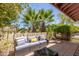 Inviting outdoor patio with comfortable seating, landscaping and sunshine at 16734 E Gunsight Dr # 109, Fountain Hills, AZ 85268