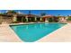 Community pool with sparkling turquoise water and lounge chairs at 16734 E Gunsight Dr # 109, Fountain Hills, AZ 85268