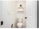 Powder room with tiled floors and a white toilet at 16734 E Gunsight Dr # 109, Fountain Hills, AZ 85268