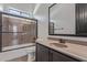 Modern bathroom featuring a shower-over-tub and a vanity with a large mirror and ample lighting at 1824 N Red Clf, Mesa, AZ 85207