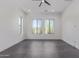 Large bedroom with gray tile floors, a ceiling fan, and many windows for natural light at 1824 N Red Clf, Mesa, AZ 85207
