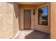 Home entryway with a Craftsman-style front door, brick pavers, and decorative lighting at 1824 N Red Clf, Mesa, AZ 85207