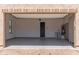 Open garage with epoxy flooring and built-in storage, providing a clean and organized space at 1824 N Red Clf, Mesa, AZ 85207