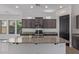 Kitchen island featuring granite countertops, a sink, and ample cabinet space at 1824 N Red Clf, Mesa, AZ 85207