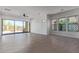 Open living room featuring tile floors, recessed lighting, and large sliding glass doors to patio at 1824 N Red Clf, Mesa, AZ 85207