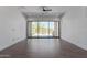 Bright living room with tile flooring and sliding glass doors to the outdoor area at 1824 N Red Clf, Mesa, AZ 85207