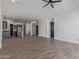 Spacious living room featuring tile floors, recessed lighting, and access to the kitchen at 1824 N Red Clf, Mesa, AZ 85207