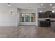 Living space open to the kitchen, featuring tile flooring and modern finishes at 1824 N Red Clf, Mesa, AZ 85207