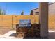 Outdoor kitchen with a stainless steel grill, sink and counter space built with decorative brick for entertaining guests at 1824 N Red Clf, Mesa, AZ 85207