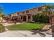 Private backyard features a grassy area, seating, and a covered patio at 1902 S Rialto -- # Mesa, Mesa, AZ 85209