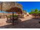 Outdoor backyard area with a fire pit, seating, and manicured landscaping at 1902 S Rialto -- # Mesa, Mesa, AZ 85209