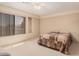 Cozy bedroom with a ceiling fan and plenty of natural light, great for relaxation at 1902 S Rialto -- # Mesa, Mesa, AZ 85209